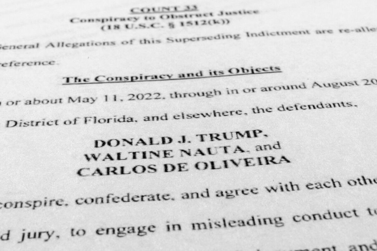 The updated indictment against former President Donald Trump, Walt Nauta and Carlos De Oliveira is photographed Thursday, July 27, 2023. Pic: AP Photo/Jon Elswick