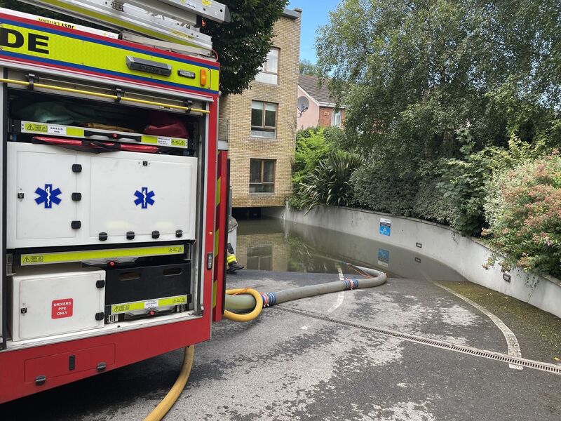 Workers from Dublin Fire Brigade and Dublin City Council drain an area in Clontarf, Dublin that was hit by flooding. Picture: Grainne Ni Aodha/PA Wire