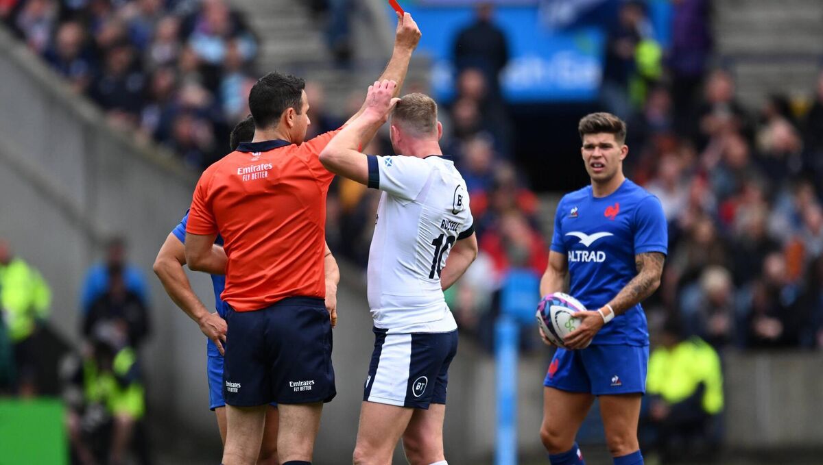 OFF...eventually. Scotland’s Zander Fagerson is shown a red card by Referee Ben O’Keefe. Pic: Craig Watson, Inpho