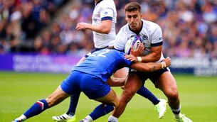 <p>Scotland's Cameron Redpath (right) is tackled by France's Antoine Hastoy at Murrayfield Stadium</p>