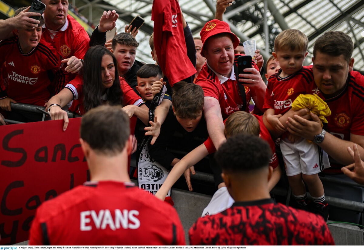 Jadon Sancho, right, and Jonny Evans of Manchester United with supporters after the pre-season friendly match between Manchester United and Athletic Bilbao at the Aviva Stadium in Dublin. Photo by David Fitzgerald/Sportsfile