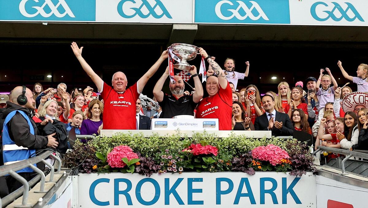 Cork Goalkeeper Coach Teddy O’Donovan lifts the Sean O'Duffy Cup with Manager Matthew Twomey. Pic Credit ©INPHO/Ben Brady
