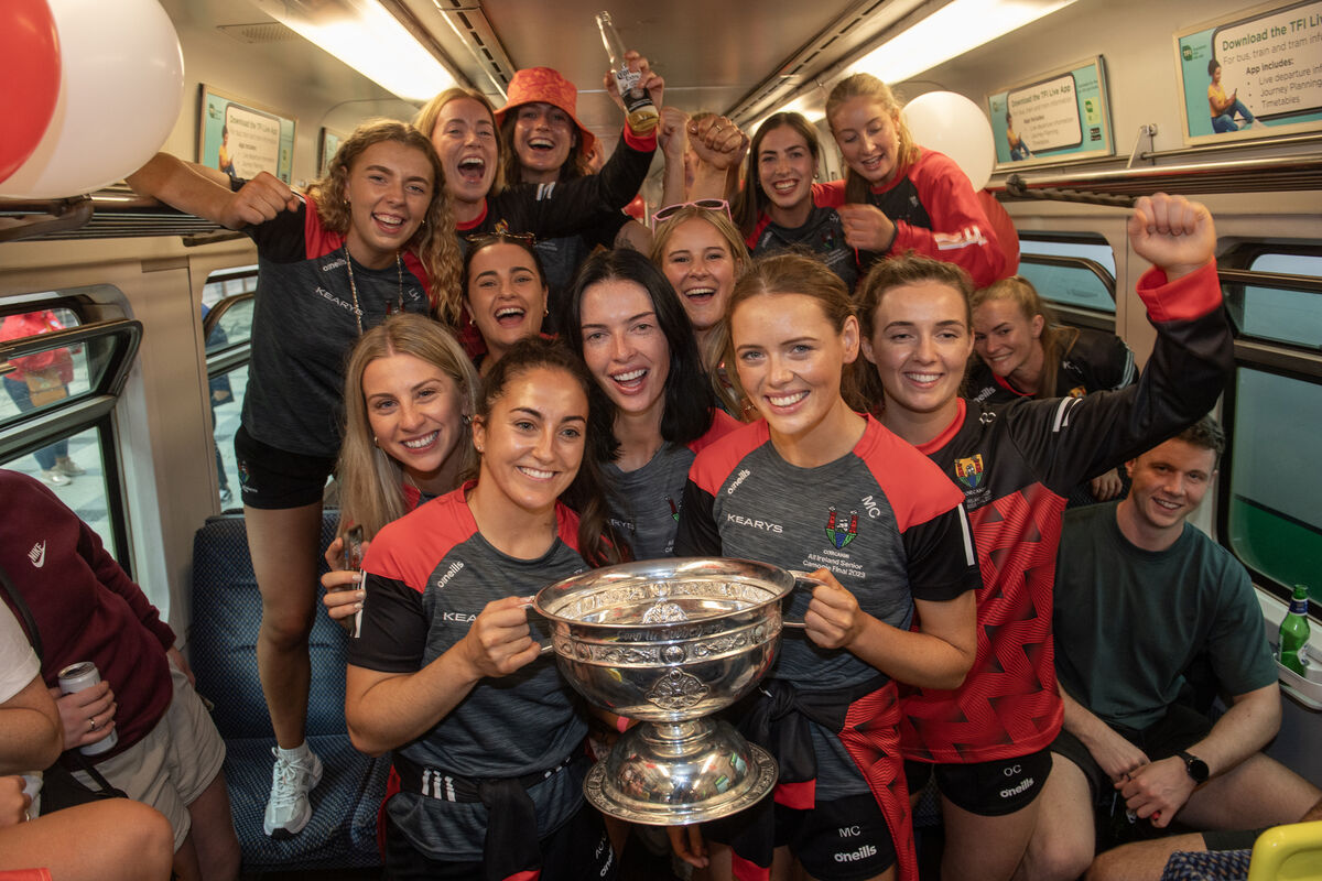  Cork captain Amy O'Connor and Meabh Cahalane holding the the O'Duffy Cup as they arrived back in Kent Station, Cork. Picture: Dan Linehan