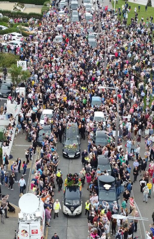 Fans of singer Sinéad O'Connor line the streets for a "last goodbye" to the Irish singer as her funeral cortege passes through her former hometown of Bray, Co Wicklow. Picture: Niall Carson/PA Wire Fans of singer Sinéad O'Connor line the streets for a "last goodbye" to the Irish singer as her funeral cortege passes through her former hometown of Bray, Co Wicklow. Picture: Niall Carson/PA Wire