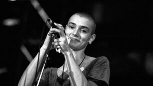 <p>Sinéad O’Connor, at the Point Theatre in Dublin in 1991. Picture: Eamonn Farrell/RollingNews.ie</p>