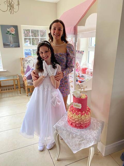 Órlaith Fallon and her cousin Aoibhinn on her Communion Day