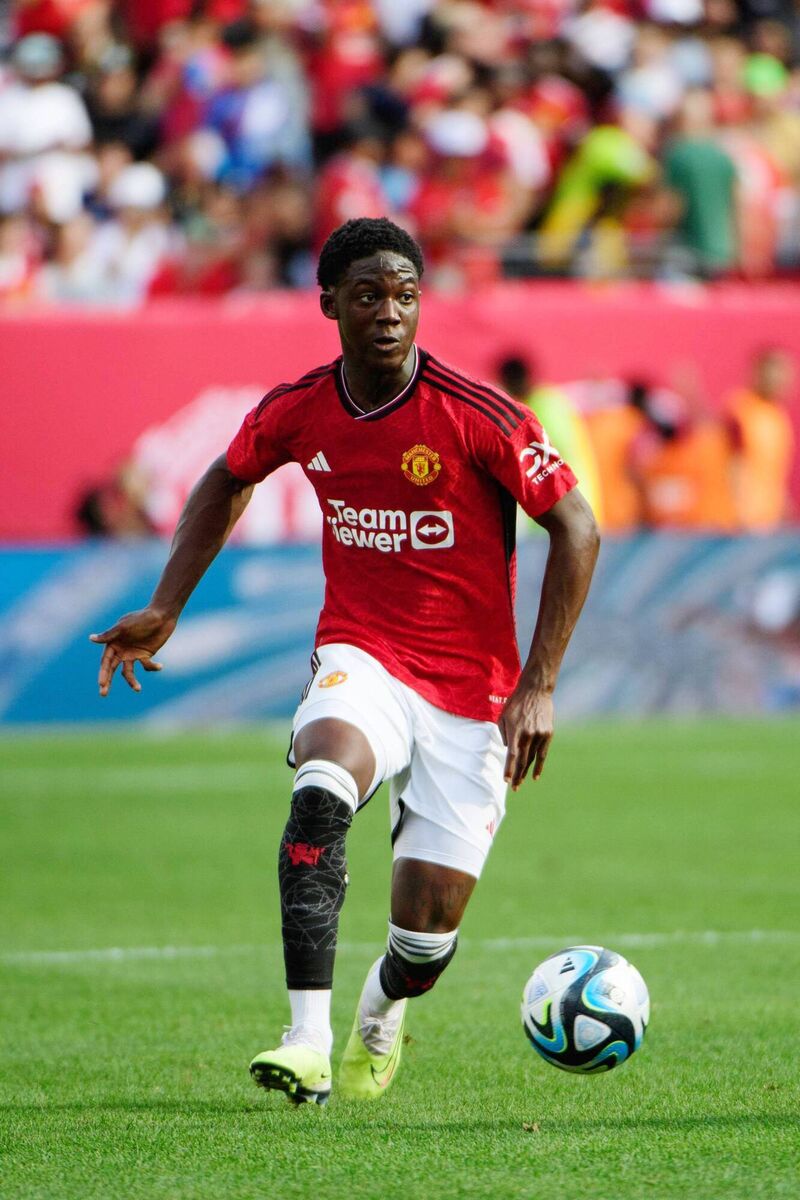 ONE TO WATCH: The 17-year-old Kobbie Mainoo was not in the triumphant Carabao Cup final squad but was on the pitch to soak up the celebrations when Ten Hag took time to have a word in his ear, a sign of the midfielder’s potential. Pic: Howard Smith/ISI Photos/Getty Images