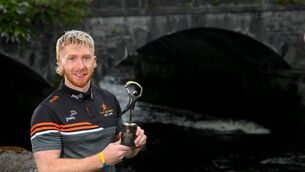 <p>PwC GAA/GPA Player of the Month for July in hurling, Cian Lynch of Limerick, with his award at PwC offices in Limerick. Photo by Stephen McCarthy/Sportsfile </p>