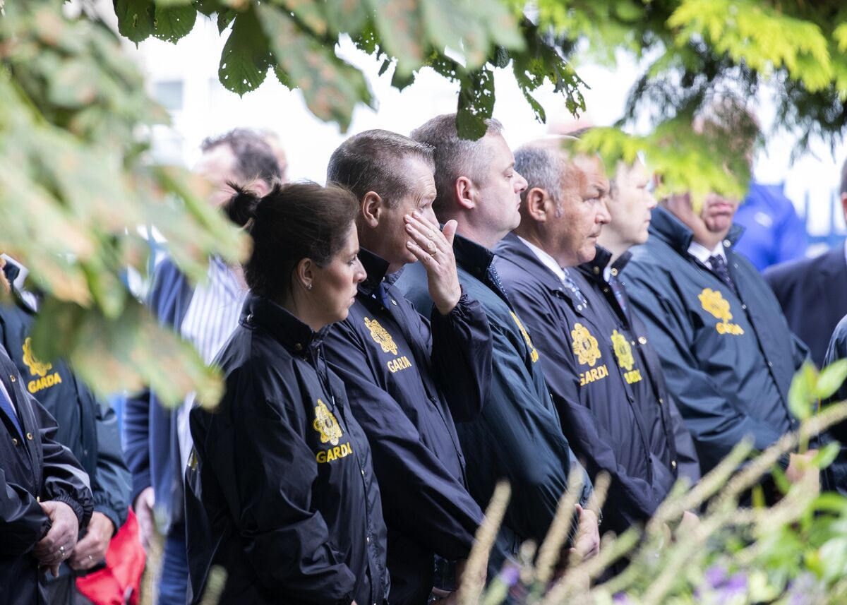Garda colleagues form a guard of honour as the cortege makes its way to church this afternoon. Picture: Colin Keegan, Collins Dublin