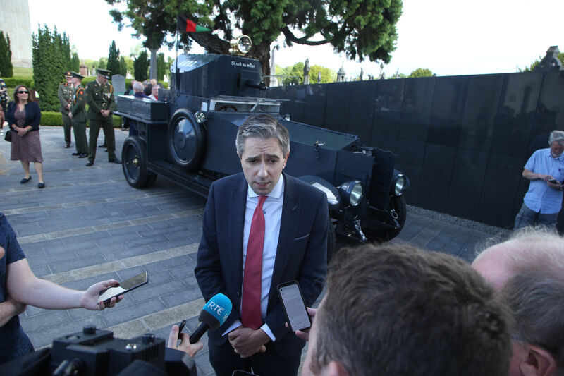 Simon Harris speaking to media at Glasnevin on Sunday. Behind him is Sliabh na mBan which was in Michael Collins' convoy when he was assassinated on August 22, 1922. Rolls Royce armoured cars were used extensively by both sides in the Irish War of Independence. Picture: Stephen Collins