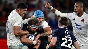 <p>FLYING FIT: Scotland's flanker Jamie Ritchie (2-L) is tackled by France's lock Bastien Chalureau (C) and France's flanker Paul Boudehent (L) during the pre-World Cup match at the Geoffroy-Guichard Stadium in Saint-Etienne. Pic: Jeff Pachoud/AFP via Getty Images</p>