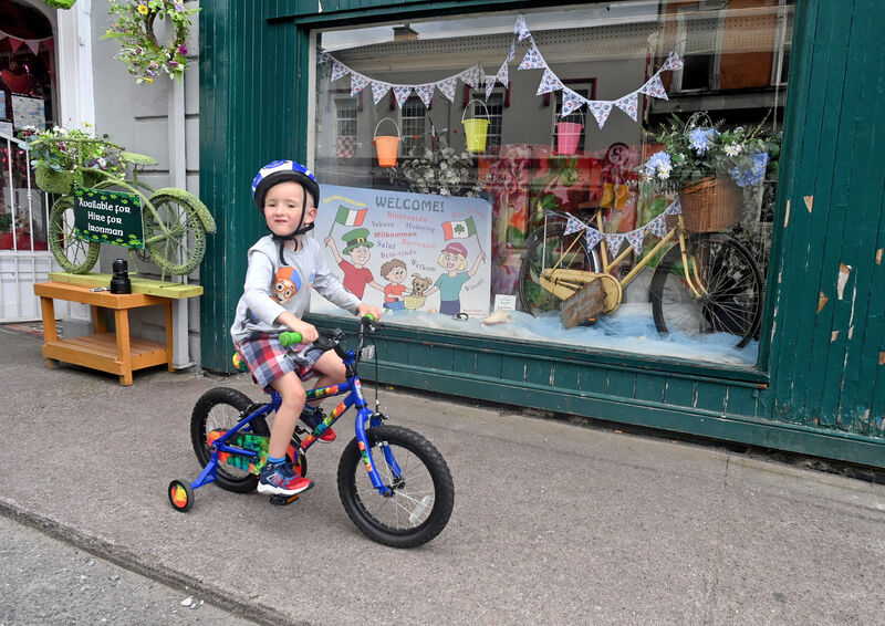 Five-year-old Alfie Moore gets in some training in front of one of the many shopfronts which have been decorated ahead of the Ironman event in Youghal Co Cork from August 18 to 20. Picture: Eddie O'Hare Five-year-old Alfie Moore gets in some training in front of one of the many shopfronts which have been decorated ahead of the Ironman event in Youghal Co Cork from August 18 to 20. Picture: Eddie O'Hare