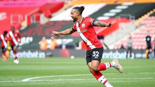 <p>Southampton's Theo Walcott celebrates scoring their side's third goal of the game during the Premier League match at St Mary's Stadium, Southampton. Picture date: Saturday May 15, 2021.</p>