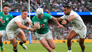 <p>STAR MAN: Ireland’s Mack Hansen goes over to score a try despite Freddie Steward and Joe Marchant of England. Picture: INPHO/Evan Treacy</p>