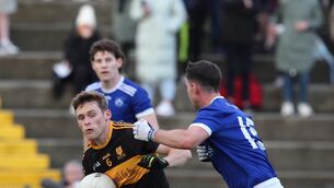 <p>TANGLED UP IN BLUE: Gavin White of Dr Crokes is tackled by Gearoid Savage, Kerins O'Rahillys in Killarney on Saturday. Photo: macmonagle, killarney</p>
