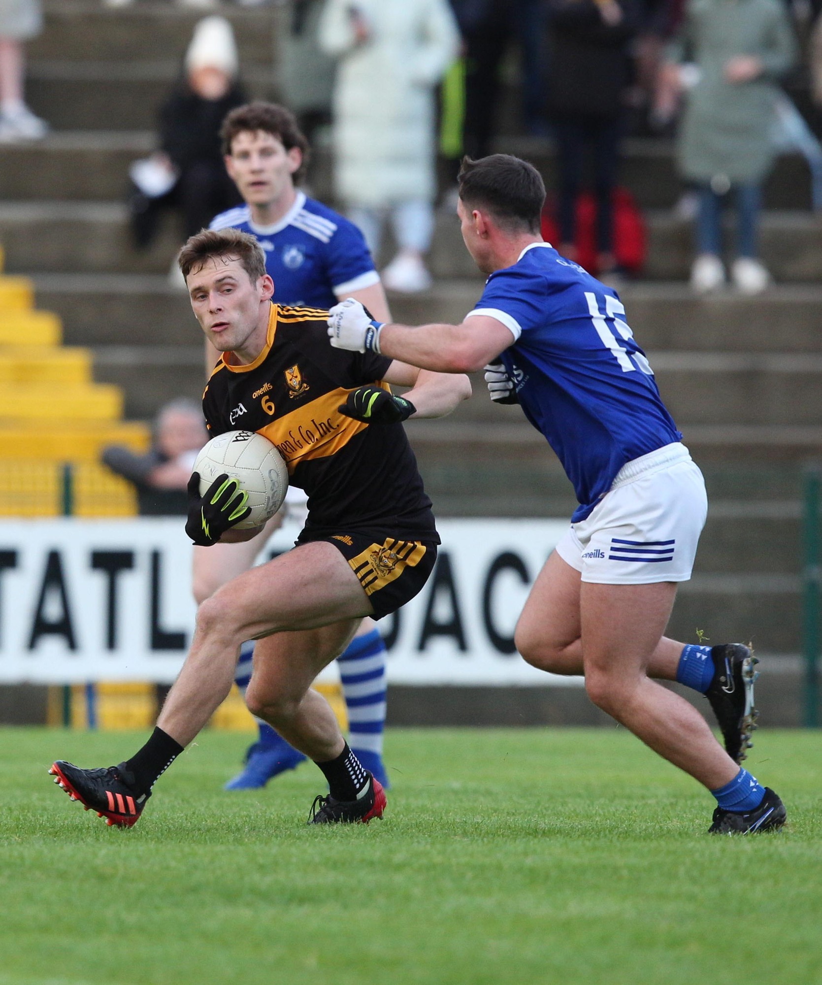 TANGLED UP IN BLUE: Gavin White of Dr Crokes is tackled by Gearoid Savage, Kerins O'Rahillys in Killarney on Saturday. Photo: macmonagle, killarney