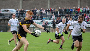 <p>Clyda Rovers' Eoin Walsh about to be tackled by Jack O'Connor of Kiskeam during the SAFC Group B match in Kanturk. Picture: David Creedon</p>