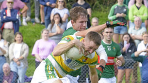 <p>CLOSE QUARTERS: Clonakilty's Ben Ridgeway tussles with Carbery's Brian Shanahan. Picture Denis Boyle</p>