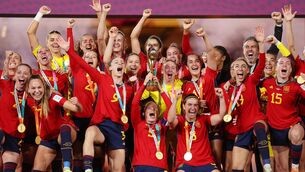 <p>CHAMPIONS: Ivana Andres of Spain and teammates celebrate with the Fifa Women's World Cup Trophy. Pic: Catherine Ivill/Getty Images</p>