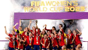 <p>DESERVING WINNERS: Spain's Ivana Andres lifts the Fifa Women's World Cup trophy as she celebrates with her team-mates after winning the Fifa Women's World Cup final match at Stadium Australia, Sydney. Pic: PA</p>