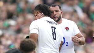 <p>ANXIOUS WAIT: England's Billy Vunipola is consoled after seeing his yellow card upgraded to a red card against Ireland. Pic: PA</p>