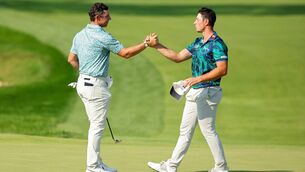 <p>JOB WELL DONE: Rory McIlroy congratulates Viktor Hovland on the 18th green at Olympia Fields after the final round of the BMW Championship. Pic: Stacy Revere/Getty Images</p>