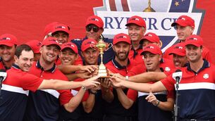 <p>USA celebrate with the Ryder Cup after victory against Europe at Whistling Straits two years ago. Picture: Anthony Behar/PA </p>