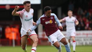 <p>BURNLEY-BOUND: Oisin McEntee of Walsall and Aaron Ramsey of Aston Villa. Pic: Barrington Coombs/Getty Images</p>