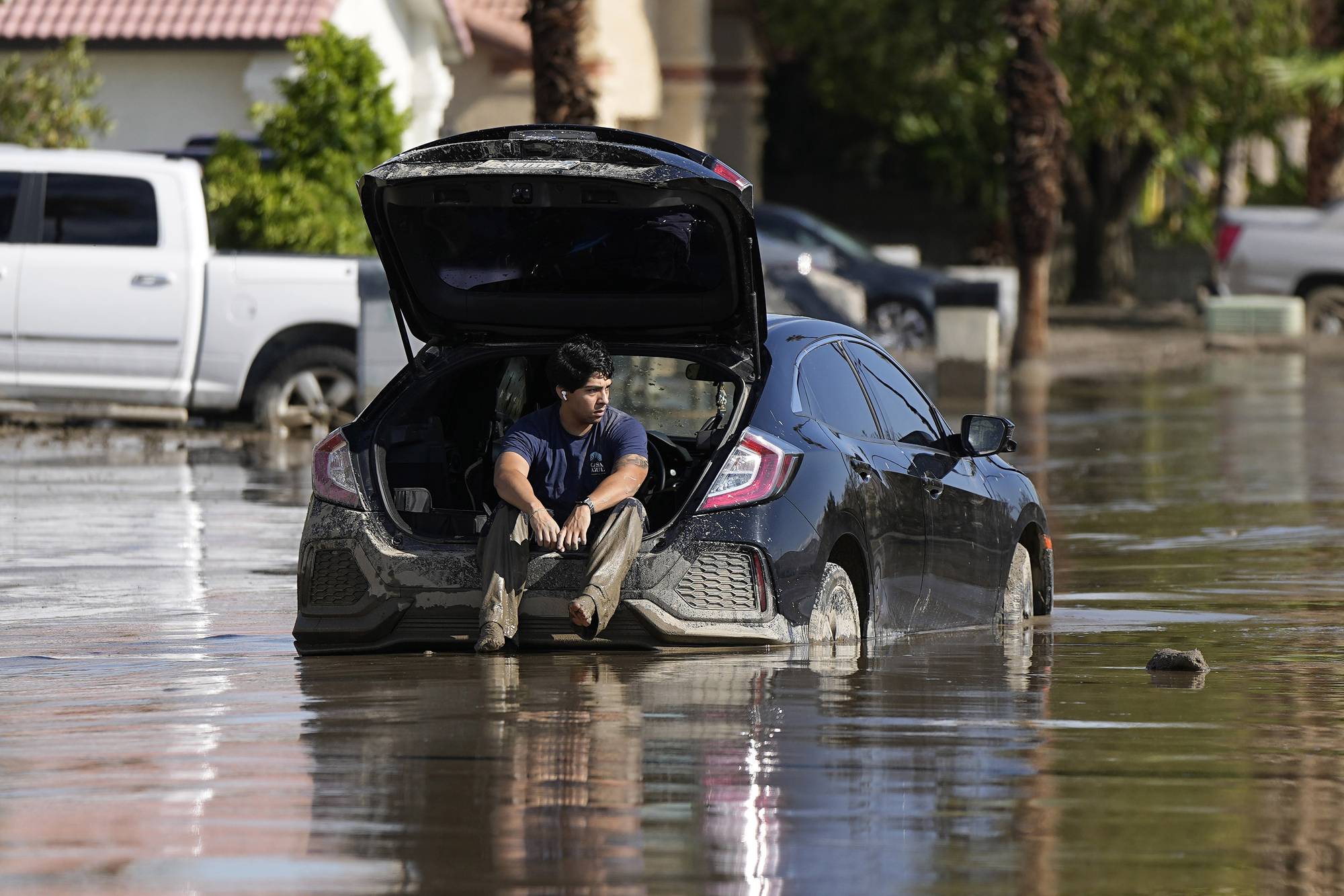 California towns dig out of the mud from first tropical storm in 84 years