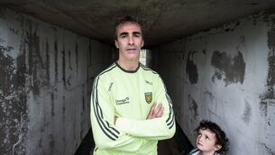 <p>MESSIAH: Jim McGuinness with his son Mark as they prepared for an All-Ireland final in 2014.</p>