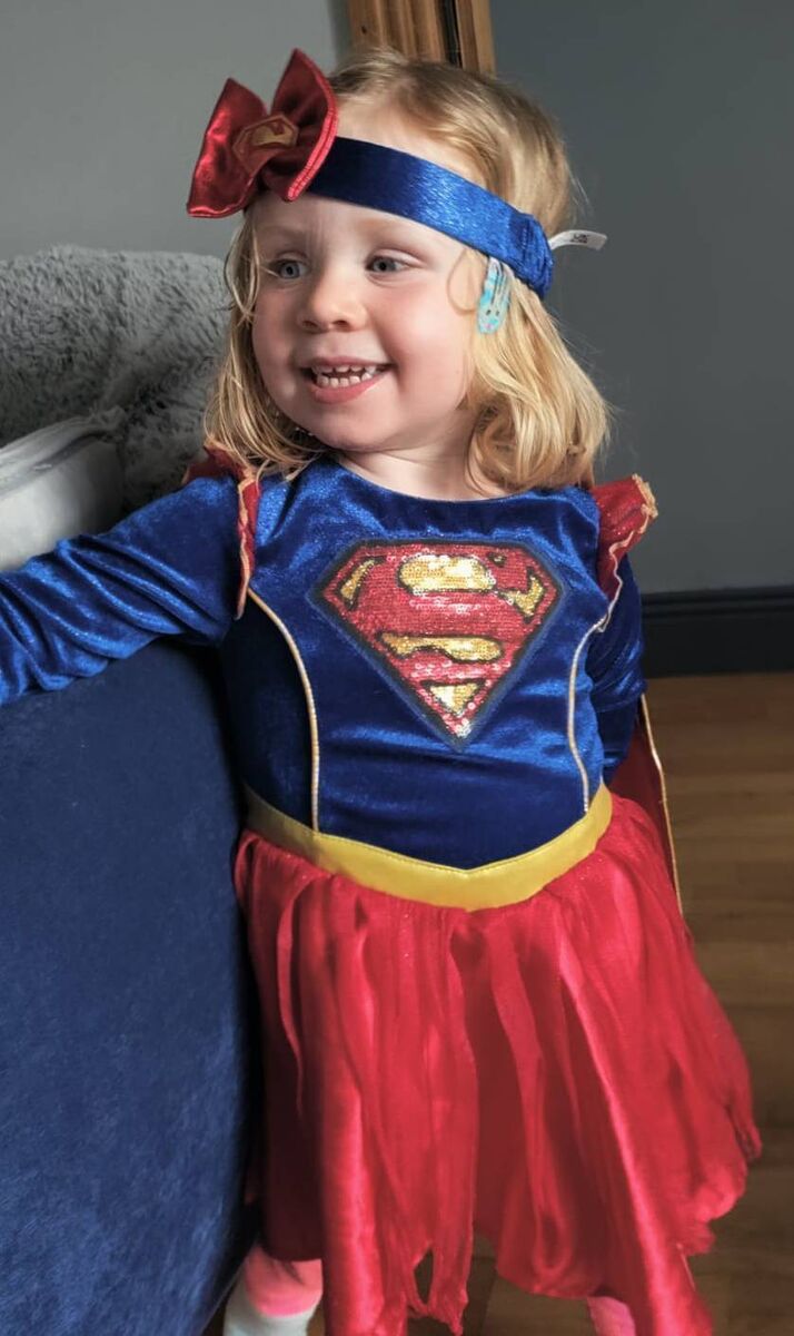 Niamh McDonagh, donning a Supergirl costume.