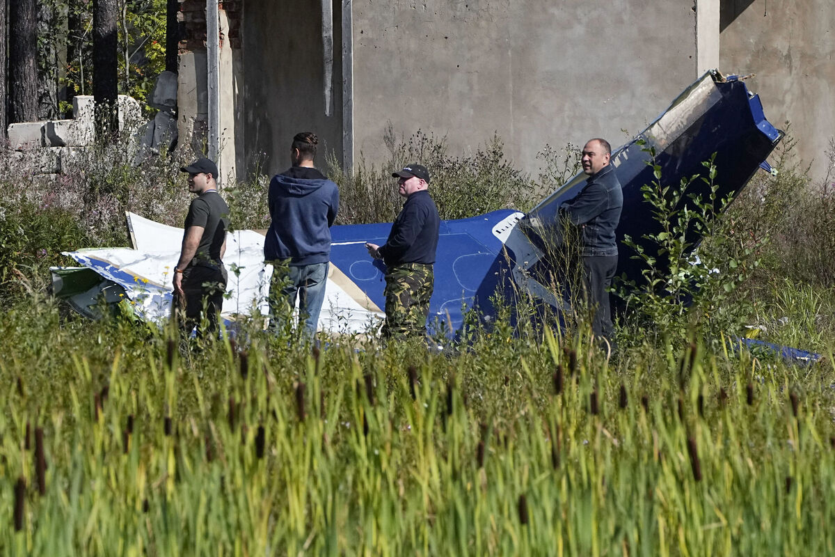 Russian servicemen inspect a part of a crashed private jet near the village of Kuzhenkino, Tver region. Picture: AP Russian servicemen inspect a part of a crashed private jet near the village of Kuzhenkino, Tver region. Picture: AP