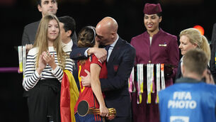 Luis Rubiales, right, hugs Spain’s Aitana Bonmati on the podium following Spain’s win (AP)