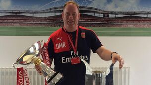 <p>SILVER SYMBOLS: Des Ryan at Arsenal with the Emirates Cup and the Premier League 2 cup</p>