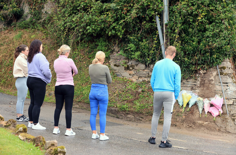 Friends of the victims lay flowers at the crash site on the Mountain Road in Clonmel. Picture: Eamonn Farrell/© RollingNews.ie Friends of the victims lay flowers at the crash site on the Mountain Road in Clonmel. Picture: Eamonn Farrell/© RollingNews.ie