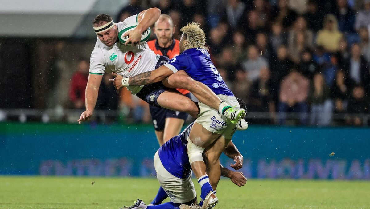 Ireland’s Rob Herring with Lima Sopoaga and Jonathan Taumateine of Samoa
