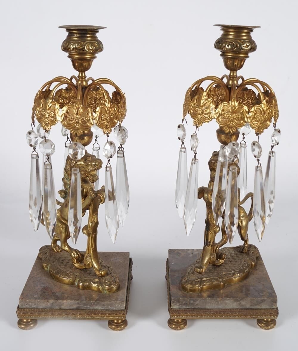 A pair of Regency gilt bronze Armorial lustres at Sheppards. A pair of Regency gilt bronze Armorial lustres at Sheppards.