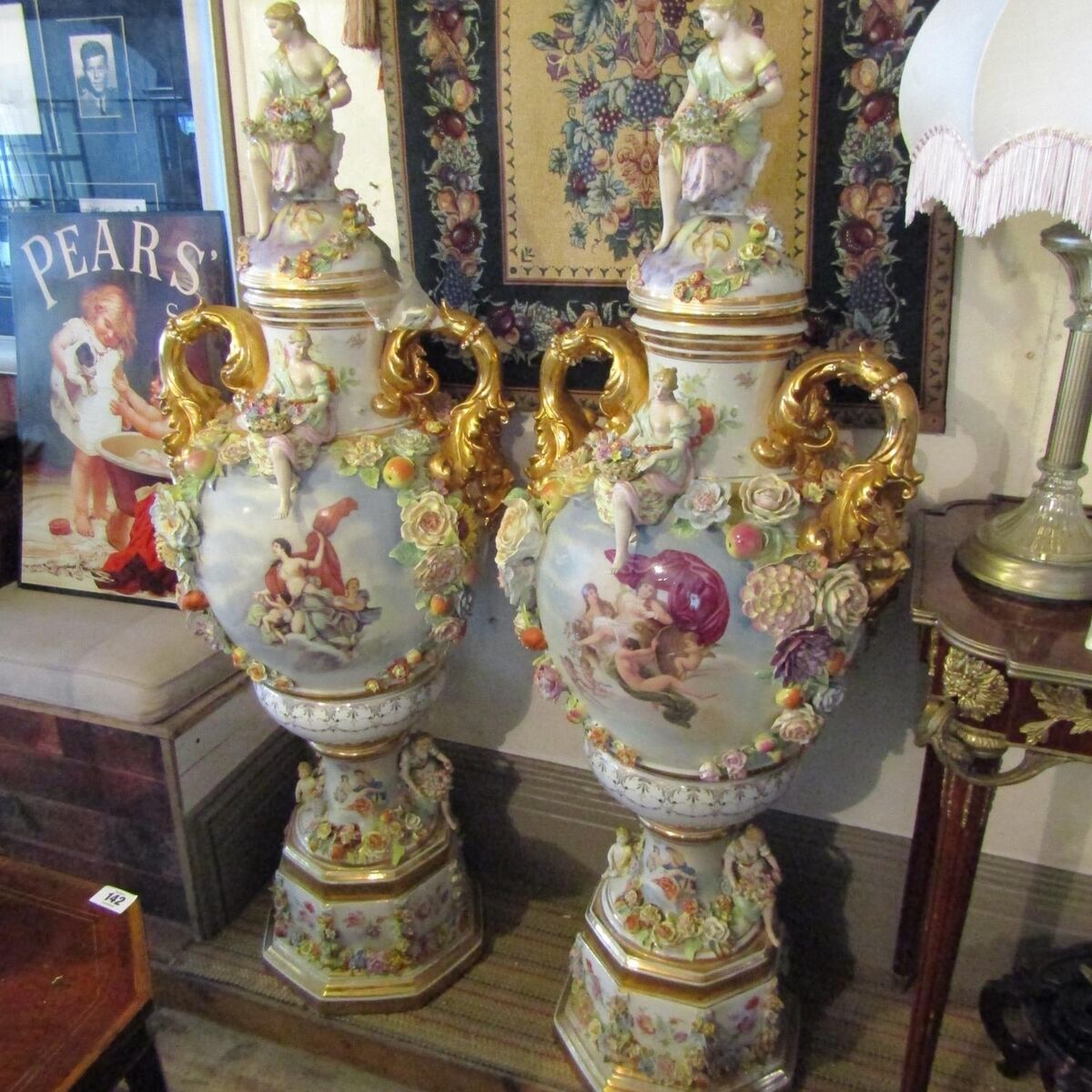 A pair of Continental porcelain floor vases, each four feet high, at Matthews.