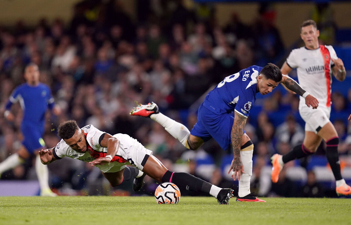 Chelsea's Enzo Fernandez and Luton Town's Jacob Brown (left) battle for the ball. Photo credit: John Walton/PA Wire.