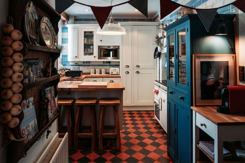  A blue and off-white colourway continues into the kitchen, a space blending practicality with a nod to the character of this period home.