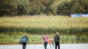 <p>PRESSURE GAME: Leona Maguire plays the 18th hole as her mam takes a photo at Dromoland Castle.</p>