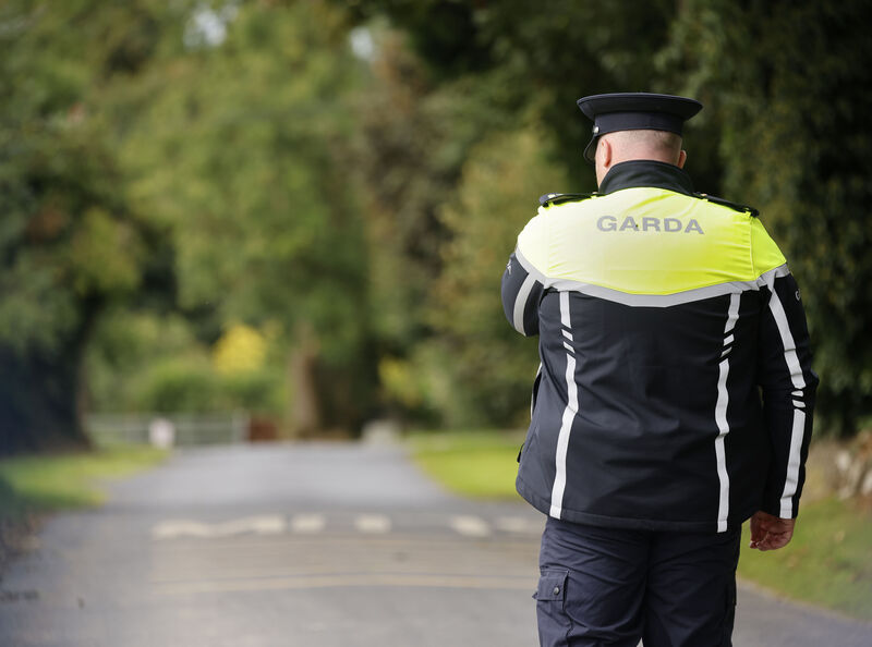A garda at the scene of the crash where three people died. Picture: Arthur Carron / Collins A garda at the scene of the crash where three people died. Picture: Arthur Carron / Collins