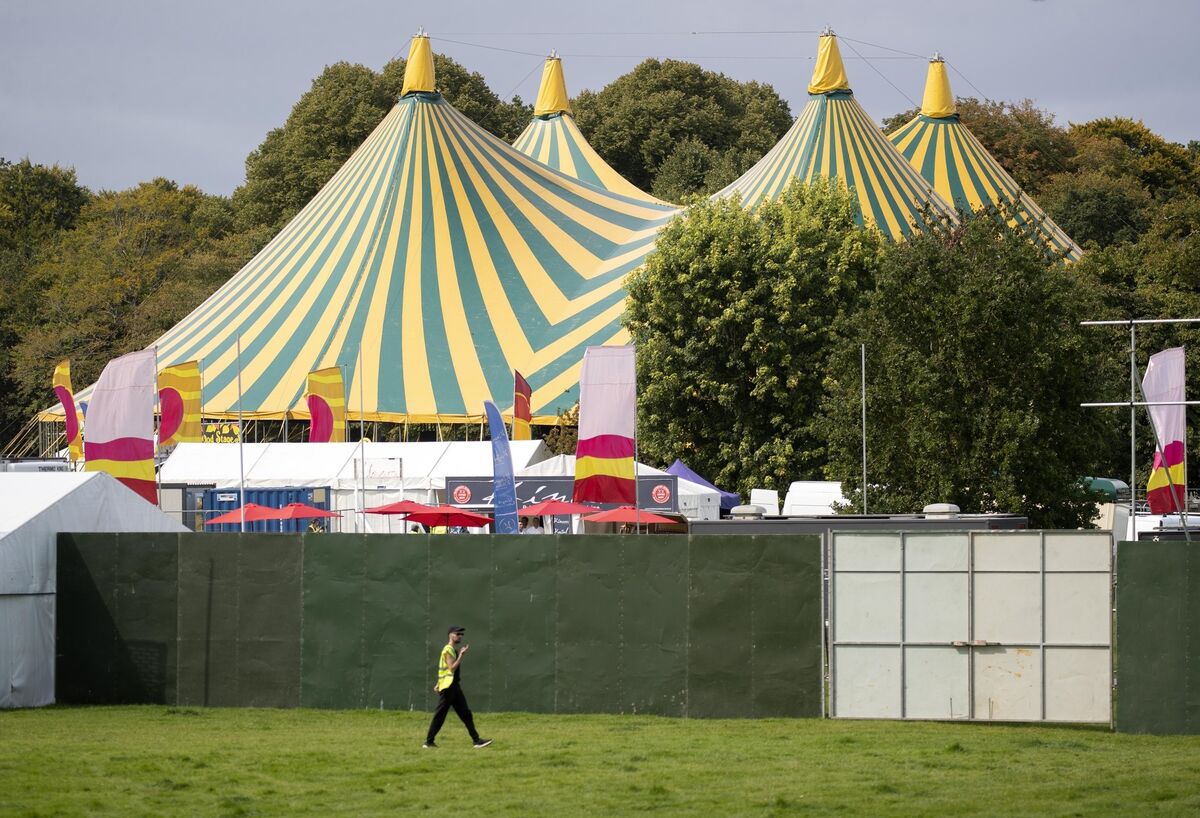 A worker walks by tents at Stradbally Hall, Co Laois. Picture: Colin Keegan, Collins Dublin