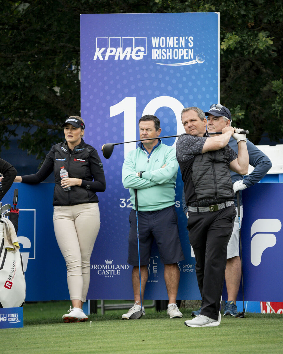 KEEN EYE: Waterford hurling manager Davy Fitzgerald drives on the 10th watched by Olivia Mehaffey. Pic: Don Moloney