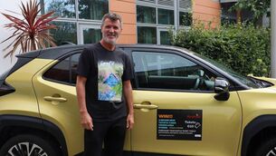 <p>Roy Keane with the winning prize of Marymount’s car raffle fundraiser — a Toyota Yaris Cross Hybrid, valued at €30,900. </p>