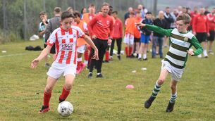 <p> Defender Sean McSweeney makes a cross into the box for Castleview against Macroom.  </p>