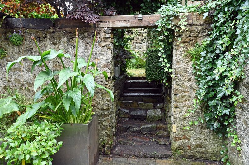 The property features a private courtyard and secluded garden.