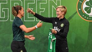 <p>HAPPIER TIMES: Katie McCabe is presented with her World Cup jersey by then Republic of Ireland manager Vera Pauw  </p>