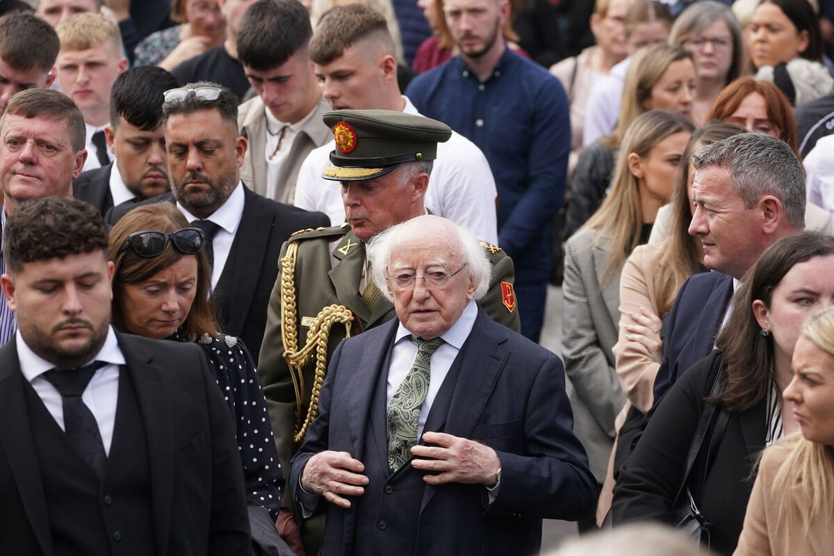 President Michael D Higgins (centre) following the funeral of siblings Luke, 24 and Grace McSweeney, 18, at Saints Peter and Paul's Church, Clonmel, Co Tipperary. Picture: Brian Lawless/PA Wire