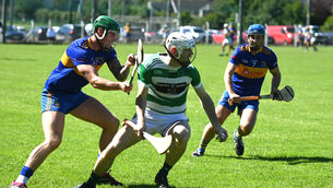 <p>KNOCKOUT STAGES: David Lynch, Valley Rovers with posession against Carrigaline in the first half of play. Pic. Larry Cummins</p>